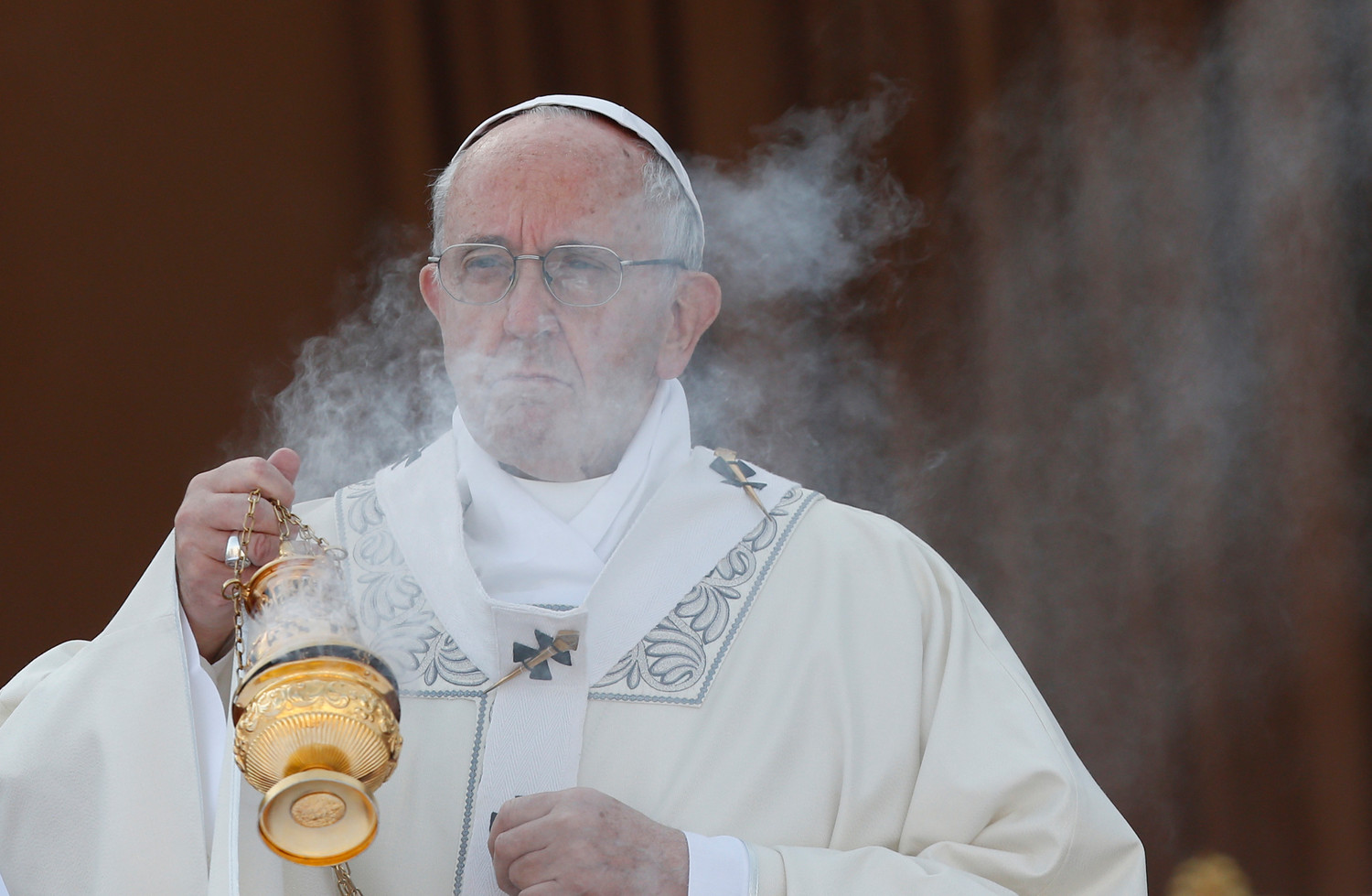 Pope Francis burns incense as he celebrates Mass marking the feast of Corpus Christi in Ostia, a suburb of Rome, June 3.